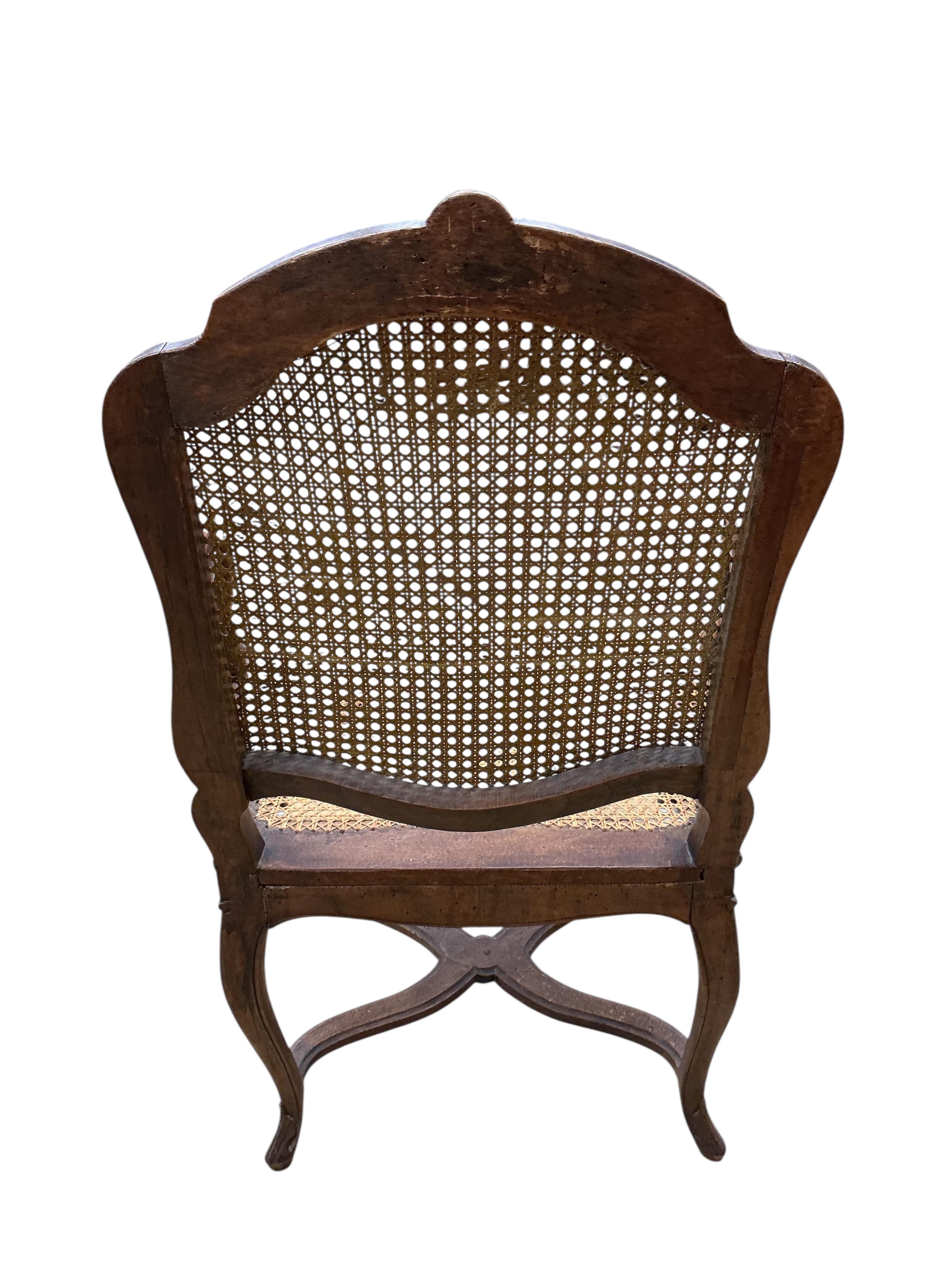 A 19th century French caned beech elbow chair, width 60cm, depth 48cm, height 90cm
